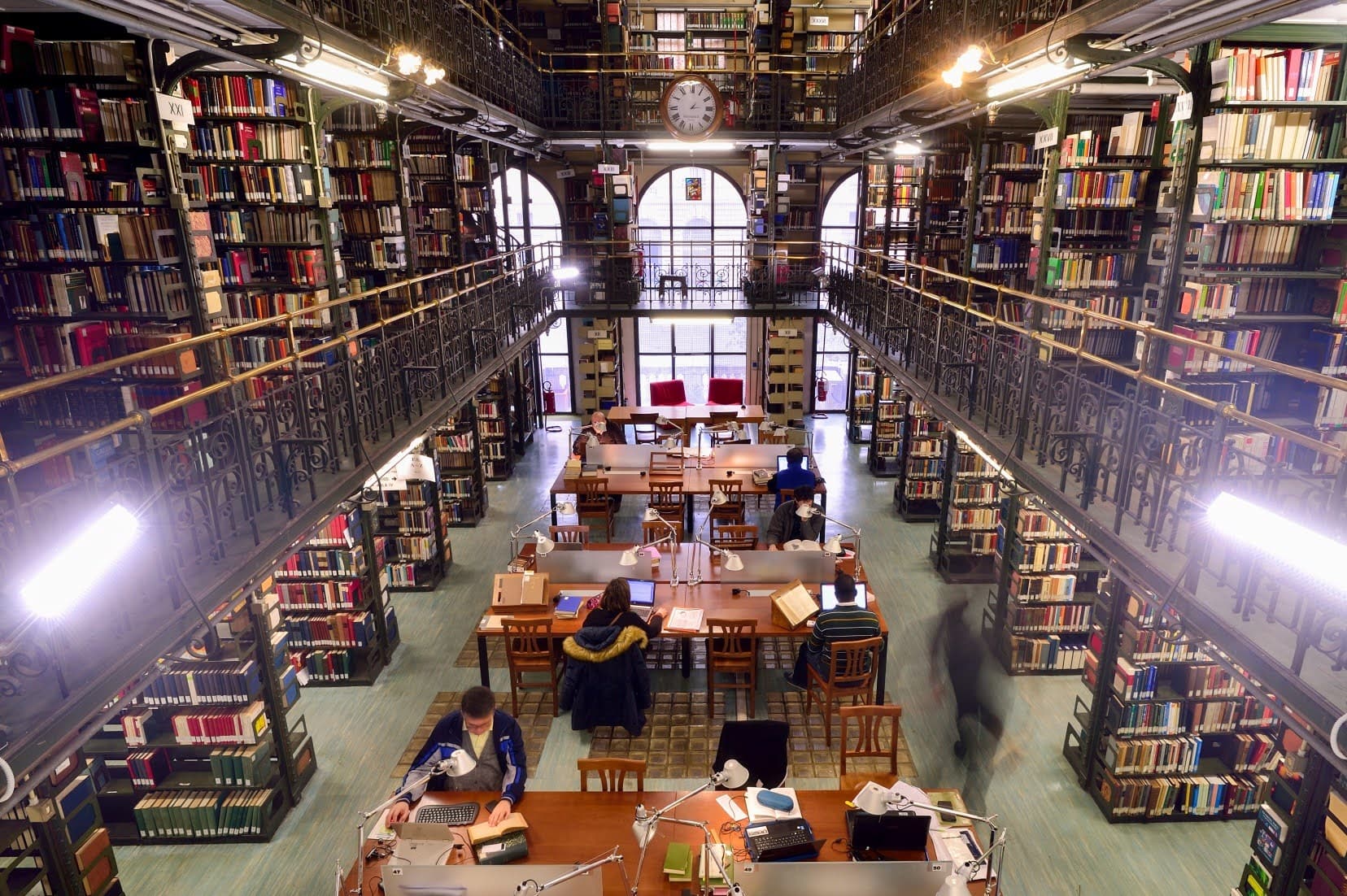 A grand library with many bookshelves.