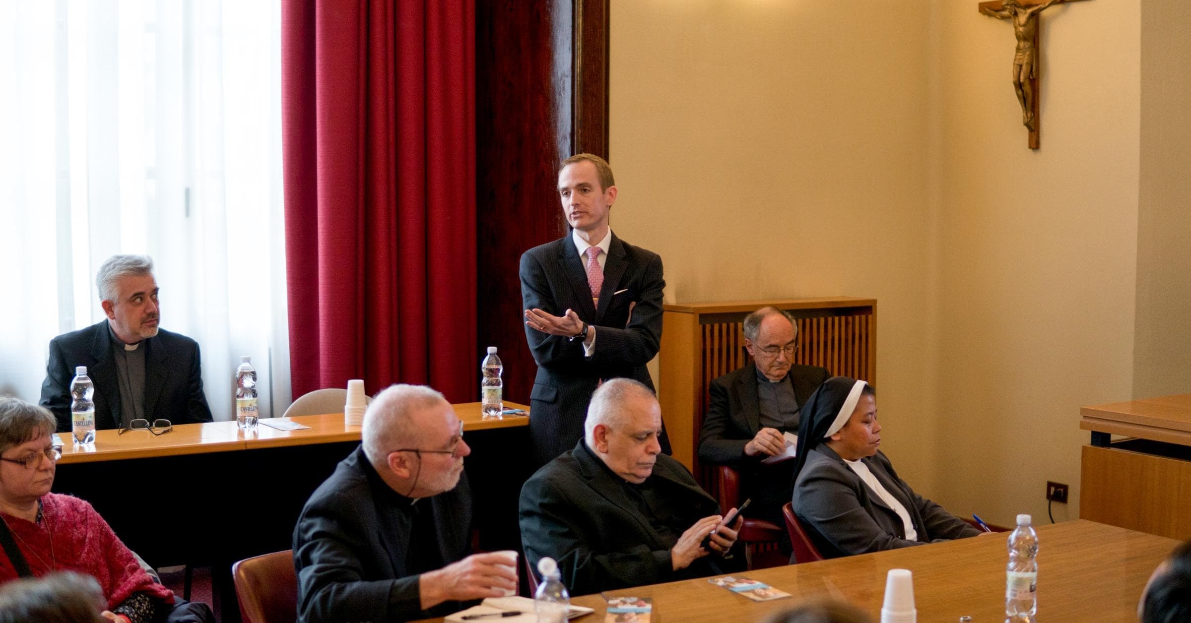 Matthew Sanders, CEO of Longbeard, presenting at the official website launch of the Migrants and Refugees Section at the Vatican. Cardinal Czerny and Fr. Fabio, leaders of the Section, in the background.