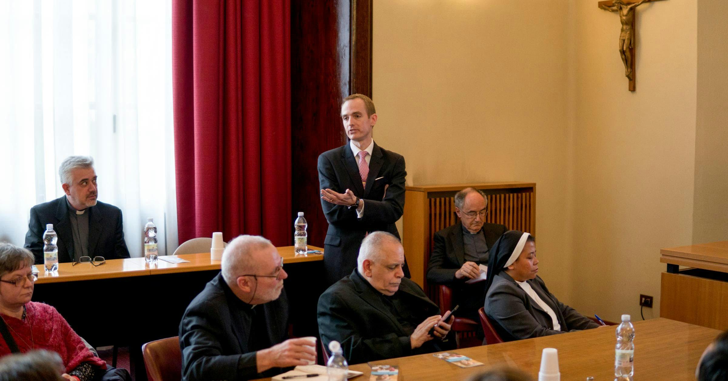 Matthew Sanders, CEO of Longbeard, presenting at the official website launch of the Migrants and Refugees Section at the Vatican. Cardinal Czerny and Fr. Fabio, leaders of the Section, in the background.